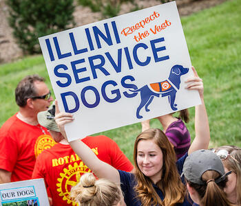 student holding sign